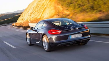 Afbeelding van een zwarte Porsche Cayman